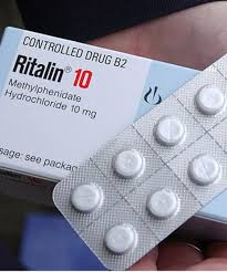 Hvide runde Ritalin 10 mg tabletter med delekærv og prægning